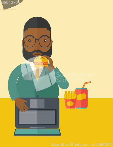 Image of Man eating hamburger. 