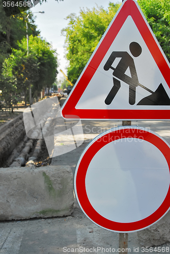 Image of Road signs in street under reconstruction