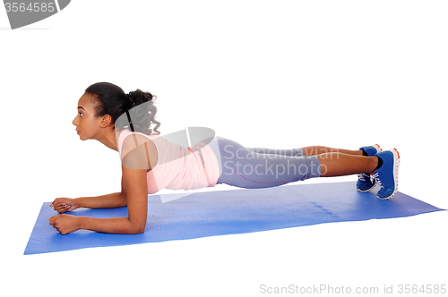 Image of Beautiful african american woman exercising.