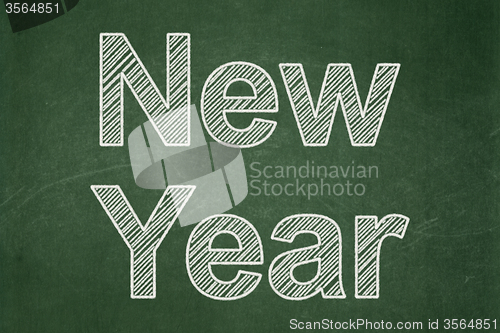 Image of Holiday concept: New Year on chalkboard background