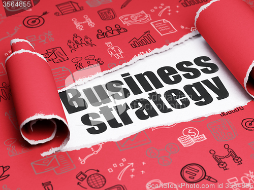 Image of Finance concept: black text Business Strategy under the piece of  torn paper