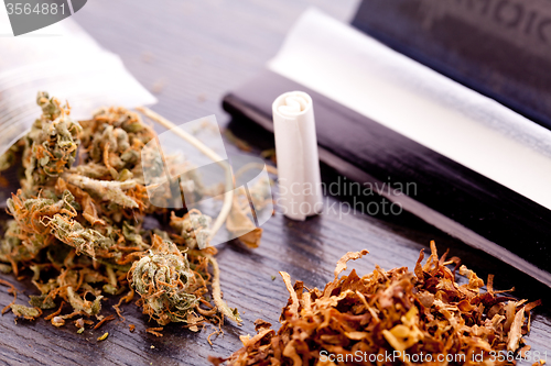 Image of Dried Cannabis on Rolling Paper with Filter