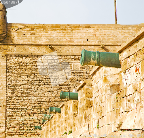 Image of  brick in old construction  africa morocco and   the tower near 