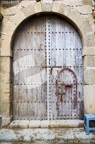 Image of antique door in morocco rusty brown