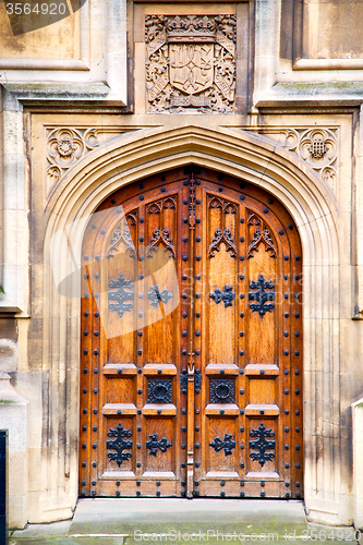 Image of parliament in london door and marble antique   