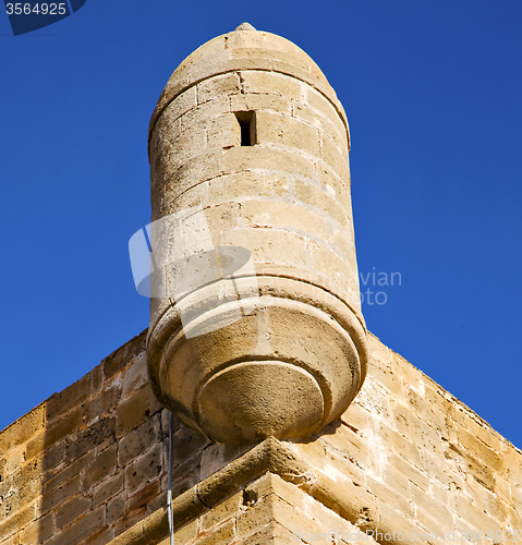 Image of  brick in old construction  africa morocco and   the tower near 