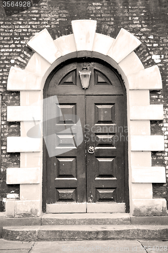 Image of wooden parliament in london old church door and marble antique  