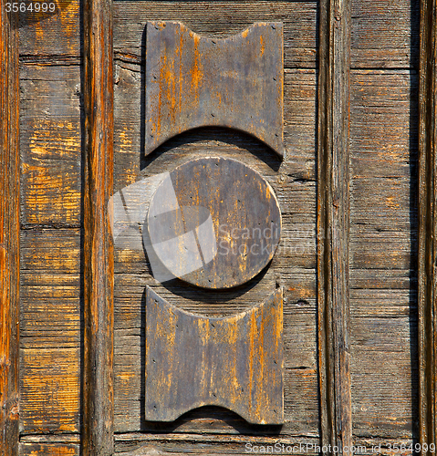 Image of castronno  varese   brown knocker  door  closed wood lombardy it