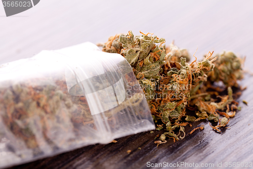 Image of Close up Dried Marijuana Leaves on the Table