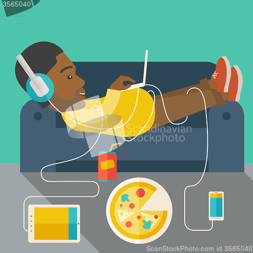 Image of Man lying on sofa.