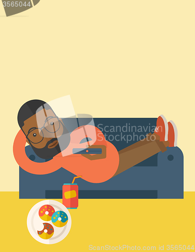 Image of Man lying on sofa.