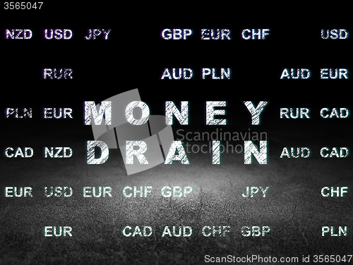 Image of Currency concept: Money Drain in grunge dark room