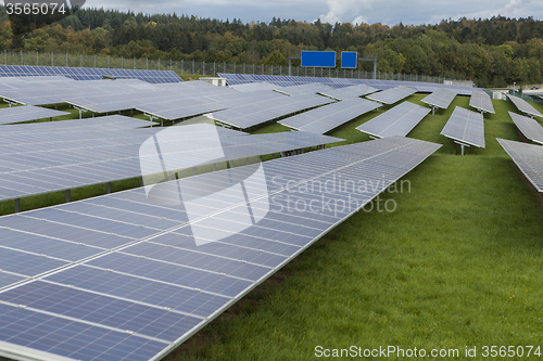 Image of Field with blue siliciom solar cells alternative energy