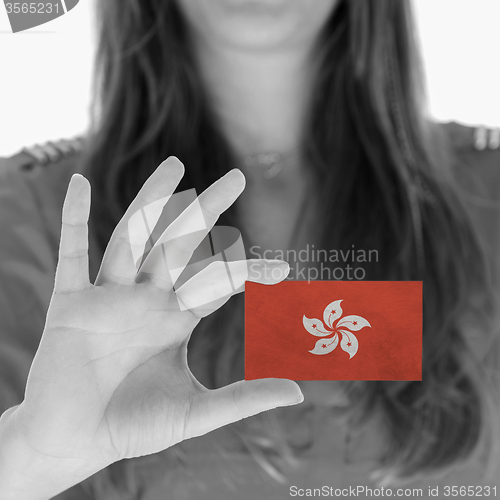 Image of Woman showing a blank business card