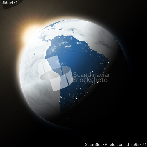 Image of Sun over South America on planet Earth