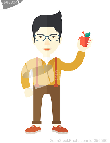 Image of Man holding apple.