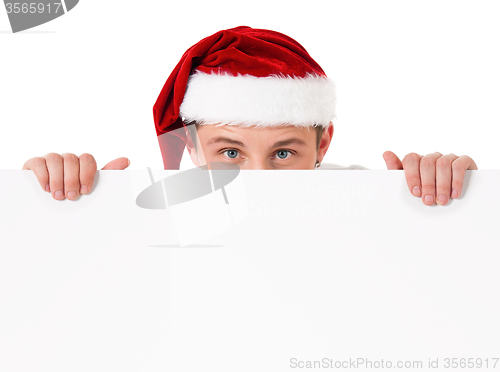 Image of Young man in Santa hat