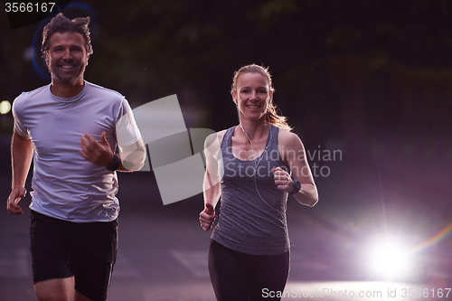 Image of couple jogging at early morning