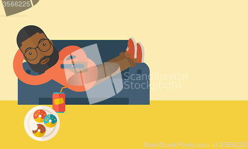 Image of Man lying on sofa.