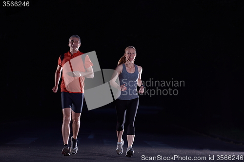 Image of couple jogging at early morning