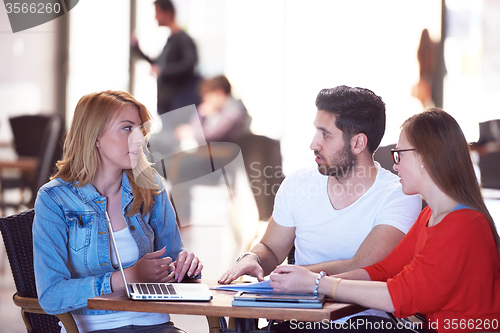 Image of students group working on school  project  together