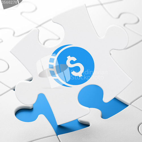 Image of Currency concept: Dollar Coin on puzzle background