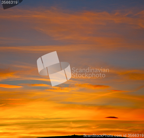 Image of sunrise in the colored sky white soft clouds and abstract backgr