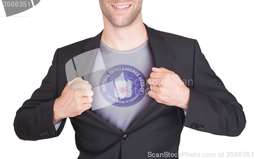 Image of Businessman opening suit to reveal shirt with flag