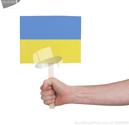 Image of Hand holding small card - Flag of Ukraine