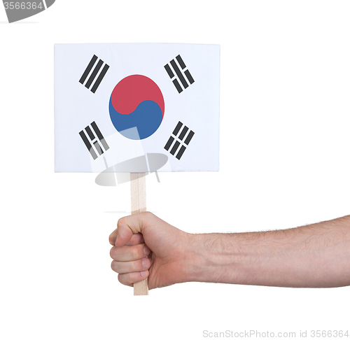 Image of Hand holding small card - Flag of South Korea