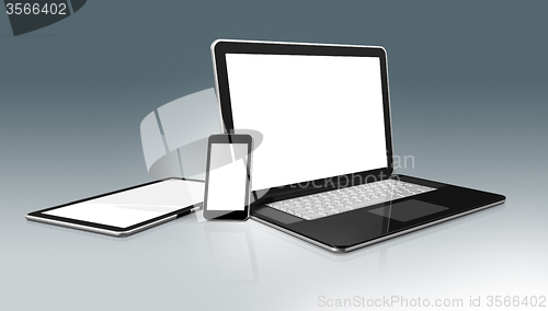 Image of High Tech computer set. Laptop, mobile phone and digital tablet 