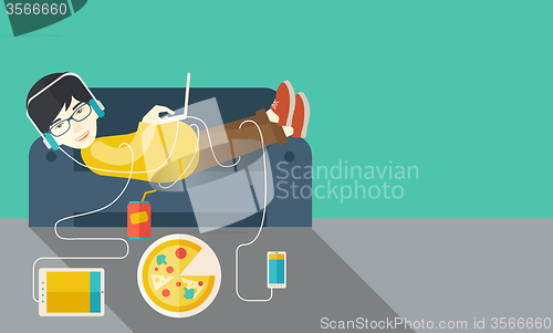 Image of Man lying on sofa.