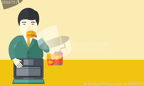 Image of Man eating hamburger. 