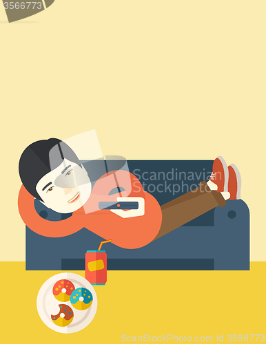 Image of Man lying on sofa.