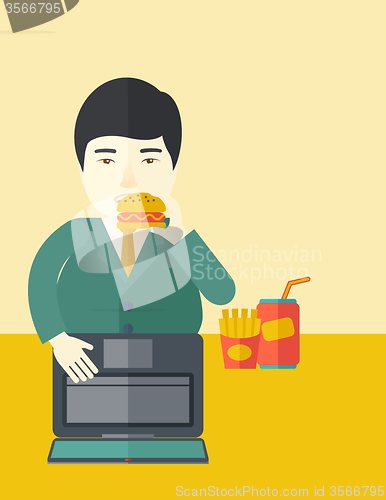 Image of Man eating hamburger. 