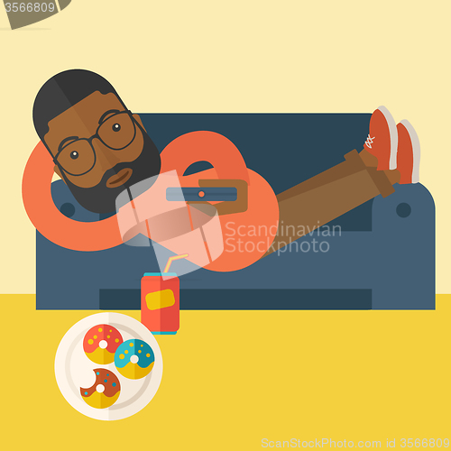 Image of Man lying on sofa.