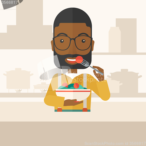 Image of Man eating salad.