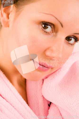 Image of beautiful woman in pink bathrobe