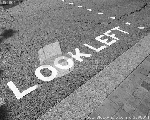 Image of Black and white Look Left sign