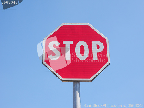 Image of Stop sign over blue sky