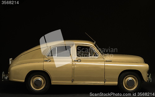 Image of  retro car side view on a black background