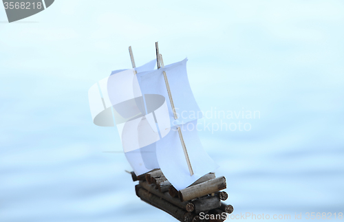 Image of  Blurred silhouette of a sailboat