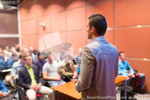 Image of Speaker at Business Conference and Presentation.