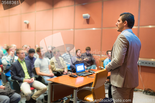 Image of Speaker at Business Conference and Presentation.