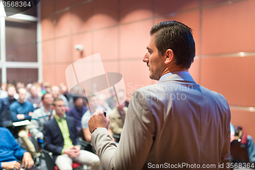 Image of Speaker at Business Conference and Presentation.