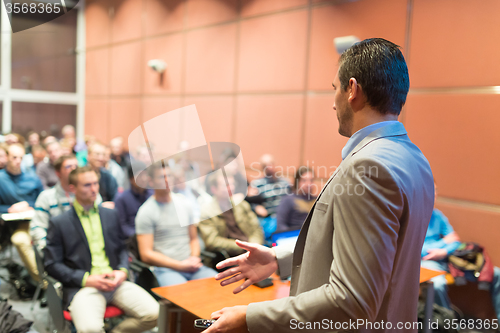 Image of Speaker at Business Conference and Presentation.