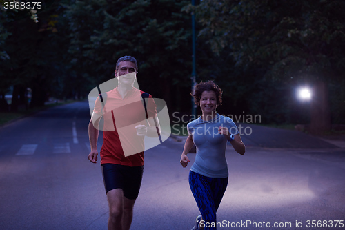 Image of couple jogging at early morning