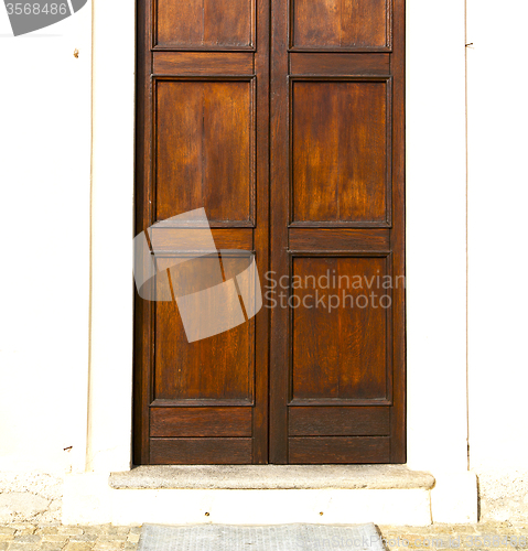 Image of  in  r a  door curch  closed metal wood italy  lombardy   milan