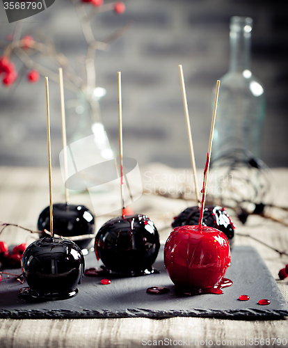 Image of Halloween black and red caramelized apples