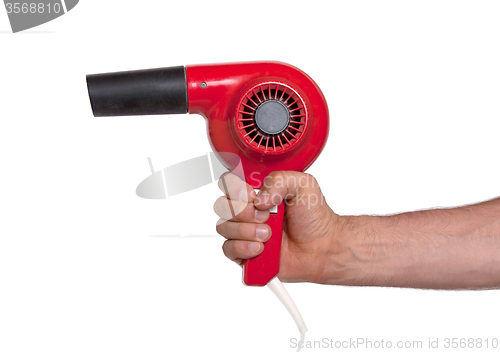 Image of Old red hairdryer in hand